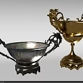 Elegant Silver and Gold Trophies with Ornate Handles and Decorative Bases
