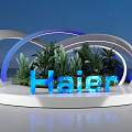 Illuminated Haier Brand Display With Curved Structures Green Plants And Blue Background