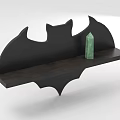 Black Bat Shaped Wall Cabinet With Green Decorative Object On Shelf