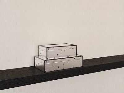 Two Silver Dotted Boxes Stacked On Dark Shelf Against Light Wall 3d model