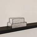 Two Silver Dotted Boxes Stacked On Dark Shelf Against Light Wall 3d model