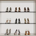 Various Women's Shoes Displayed on Glass Shelves in Cabinet with Heels Flats and Colors
