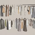 Neutral Colored Clothes Hung On Hangers With Various Styles Dresses Coats And Tops Neatly Arranged