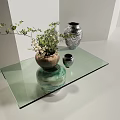 Glass Top Coffee Table Supported by Decorative Vases with Green Plant and Patterned Design