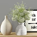 Modern Kitchen Cabinets with Black Tiled Wall Decorative Vases Green Plants Bowls and Wooden Board