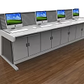 Efficient Office Desk With Four Computer Monitors Keyboards And Cabinet Doors