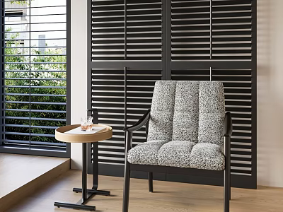 Textured Gray Lounge Chair with Small Round Table Black Louvered Shutters and Greenery View 3d model