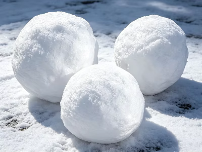 Three Round Snowballs Resting On Fresh Snowy Ground In Sunlight 3d model