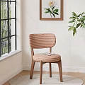 Stylish Dining Chair with Striped Backrest and Wooden Legs by Window with Green Plants