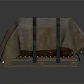 Household Item Covered With Brown Fabric And Cross Tied Black Straps On Wooden Pallet