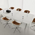 Modern White Conference Table With Brown Leather Chairs Water Bottles And Black Device