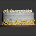 Elegant Round Cake With White Cream Frosting Yellow Petal Decorations And Pink Base