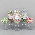 Assorted Colorful Fruit Drops And Gumballs In Glass Jars With Ribbons