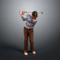 Man In Argyle Sweater Swinging Golf Club With Brown Pants And Cap