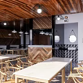 Rustic Restaurant Design Featuring Wooden Facade Outdoor Tables And Chairs