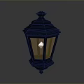 Black Decorative Lantern With Ornamental Top And Warm Yellow Light For Home Decoration