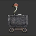 Goose Wearing Red Hat Sitting In Black Cart With Metal Wheels