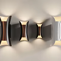 Modern Curved Wall Lights in Black Brown Silver with Warm Yellow Lighting on Gray Wall