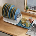 Colorful Tableware Set With Plates Utensils Mugs Teapot On Dish Rack Wooden Countertop
