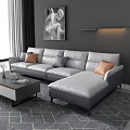 Modern Gray L Shaped Sofa and Coffee Table with Orange Gray Throw Pillows Decorative Items
