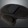 Black Computer Mouse Resting On Brown Ergonomic Mouse Pad Surface
