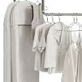 Minimalist White Clothes Hanging On Racks With Shirts Dresses And Storage Boxes