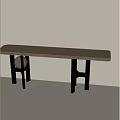 Long Wooden Dining Table With Black Legs Golden Ball Decoration Against White Wall