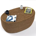 Rattan Outdoor Sofa with White Cushions and Round Coffee Table in Cozy Setting