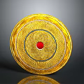 Golden Circular Decorative Plate With Central Red Gemstone And Surrounding Blue White Intricate Patterns