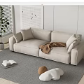 Beige Two Seater Sofa With Cushions Brown Blanket Grey Rug And Potted Plant By Window