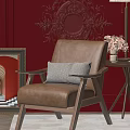 Beige Accent Chair with Herringbone Pillow against Red Wall Ornate Carving Side Table Vase Flowers