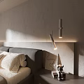 Modern Bedroom Pendant Lights Illuminating Bedside Gray Wall With Upholstered Headboard And Decorative Pillows