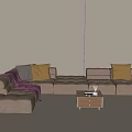Modern L Shaped Taupe Sofa Set With Throw Pillows Blanket And Coffee Table