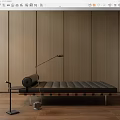 Contemporary Ottoman With Padded Cushion Against Wooden Wall Paneling And Floor Lamp Near Side Table