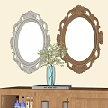 Two Oval Mirrors with Silver Gold Carved Frames Above Wooden Shelf with Vase Green Plants
