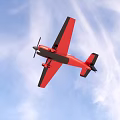 Red Passenger Airplane With Single Propeller And Black Edge Wings In Light Blue Sky
