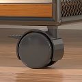 Black Furniture Wheel With Brake On Wooden Floor Surface