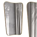 Gold Framed Decorative Mirror With Gray Curtains And Natural Light In Interior