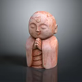 Pink Colored Man Statue with Hands in Prayer Position Closed Eyes on Neutral Gray Background