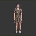 Woman in Gold Sequin Dress Standing Against Gray Background with White Sneakers