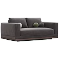 Green Velvet Two Seater Sofa With Round Pillows And Dark Wooden Base