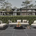 Modern Outdoor Sofa Set With Fire Pit And Lush Greenery In Patio Area