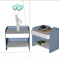 Modern Bedside Table With Vase Balloons Hat And Stacked Books On Shelf