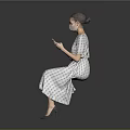 Woman In Plaid Dress And Heels Using Mobile Phone Against Grey Background