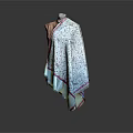 Patterned Shawl With Pink Trim On Mannequin Against Gray Background