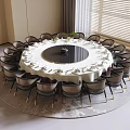 Elegant Round Dining Table and Chairs Set With White Tablecloth Tableware and Decorative Green Plant