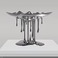 Silver Sculpture With Dripping Effect Bowl Shaped Top On White Plinth