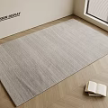 Light Gray Square Rug on Herringbone Wooden Floor with Open Book and Window Blinds