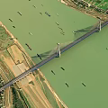 Aerial View Of Cable Stayed Bridge Spanning River With Boats And Farmland Banks