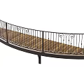 Curved Metal Railing With Ornate Scroll Designs And Wooden Deck Surface